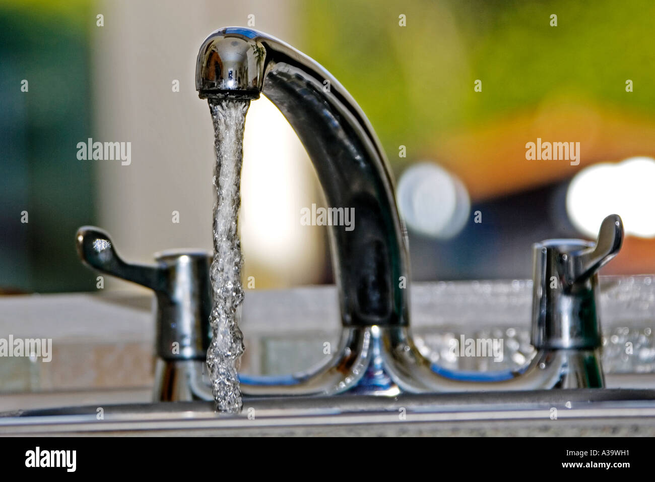 Water running from a kitchen mixer tap Stock Photo Alamy