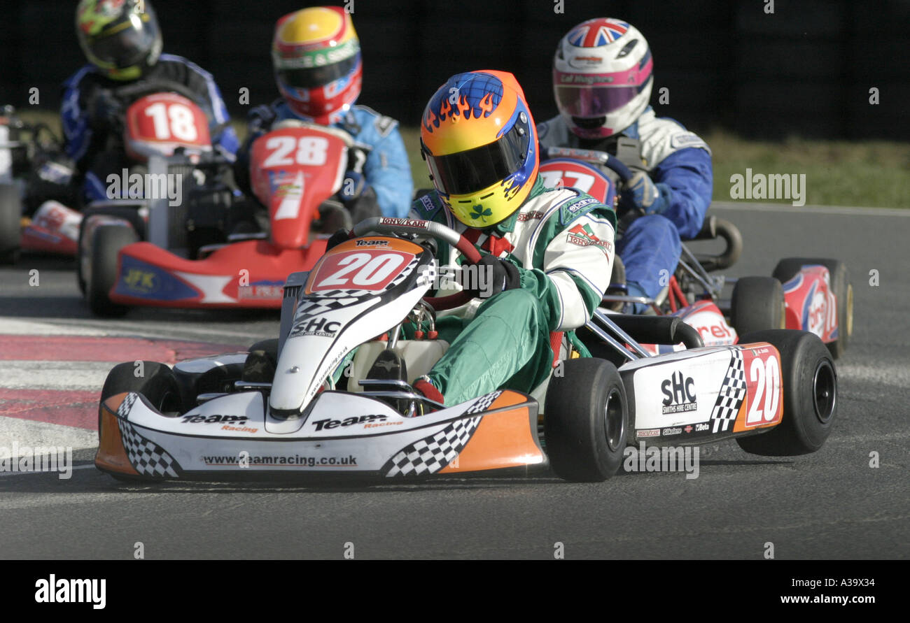 Irish Mini Max kart driver leads the field through the first corner at Nutts Corner motorsport circuit County Antrim Stock Photo
