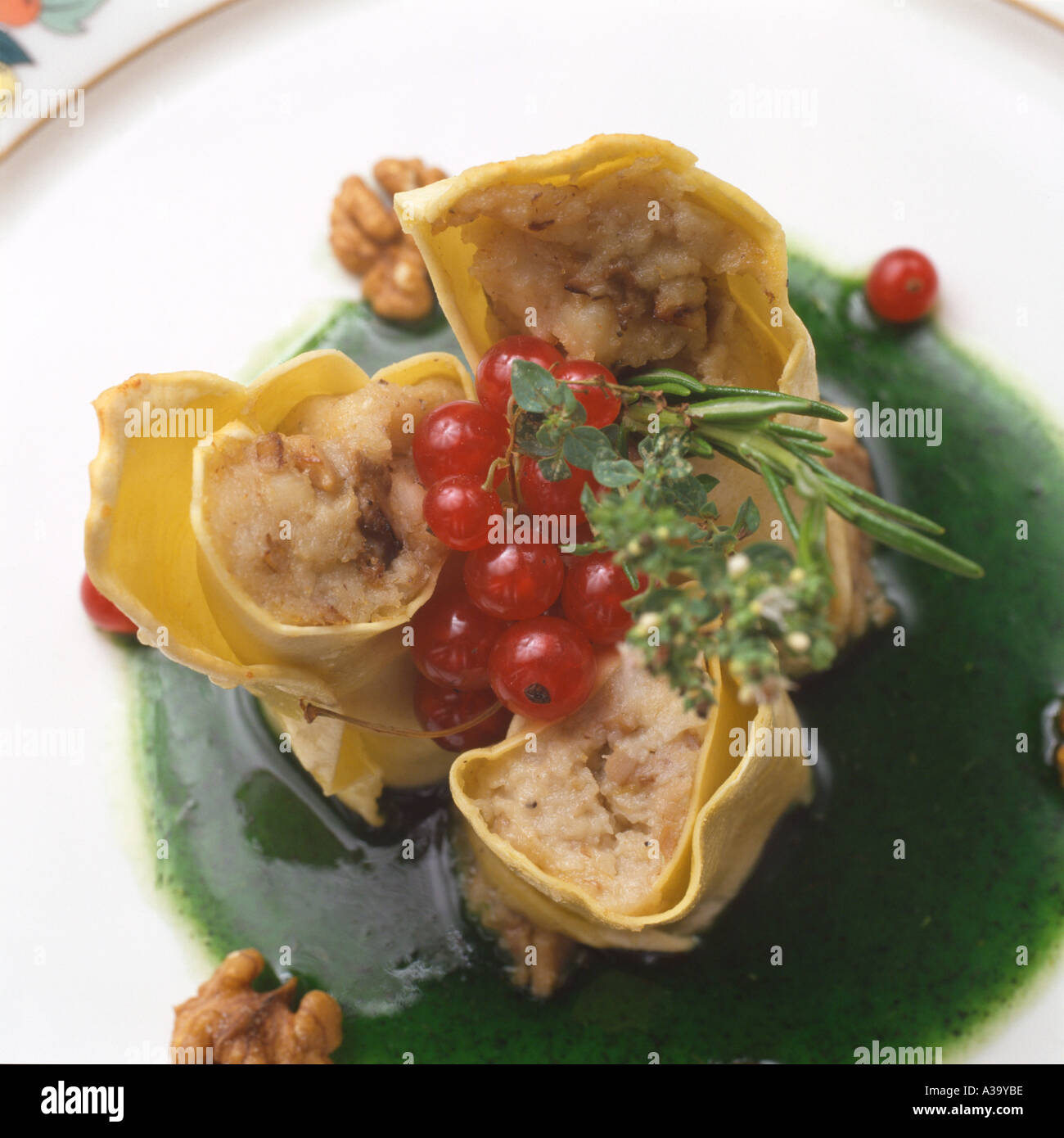 Home made cannelloni pasta filled with monk fish and porcini mushrooms italian style Stock Photo