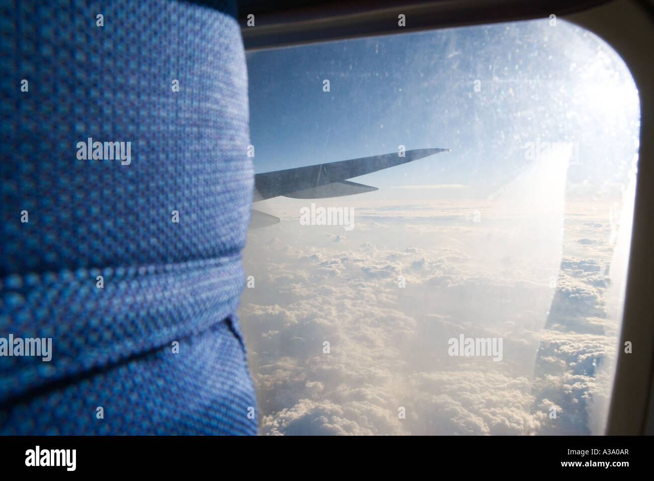 View from aeroplane window and headrest of seat. Stock Photo