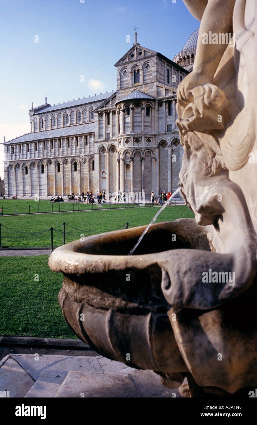 A fountain and the cathedral of Pisa at the 'Campo dei miracoli'. Stock Photo