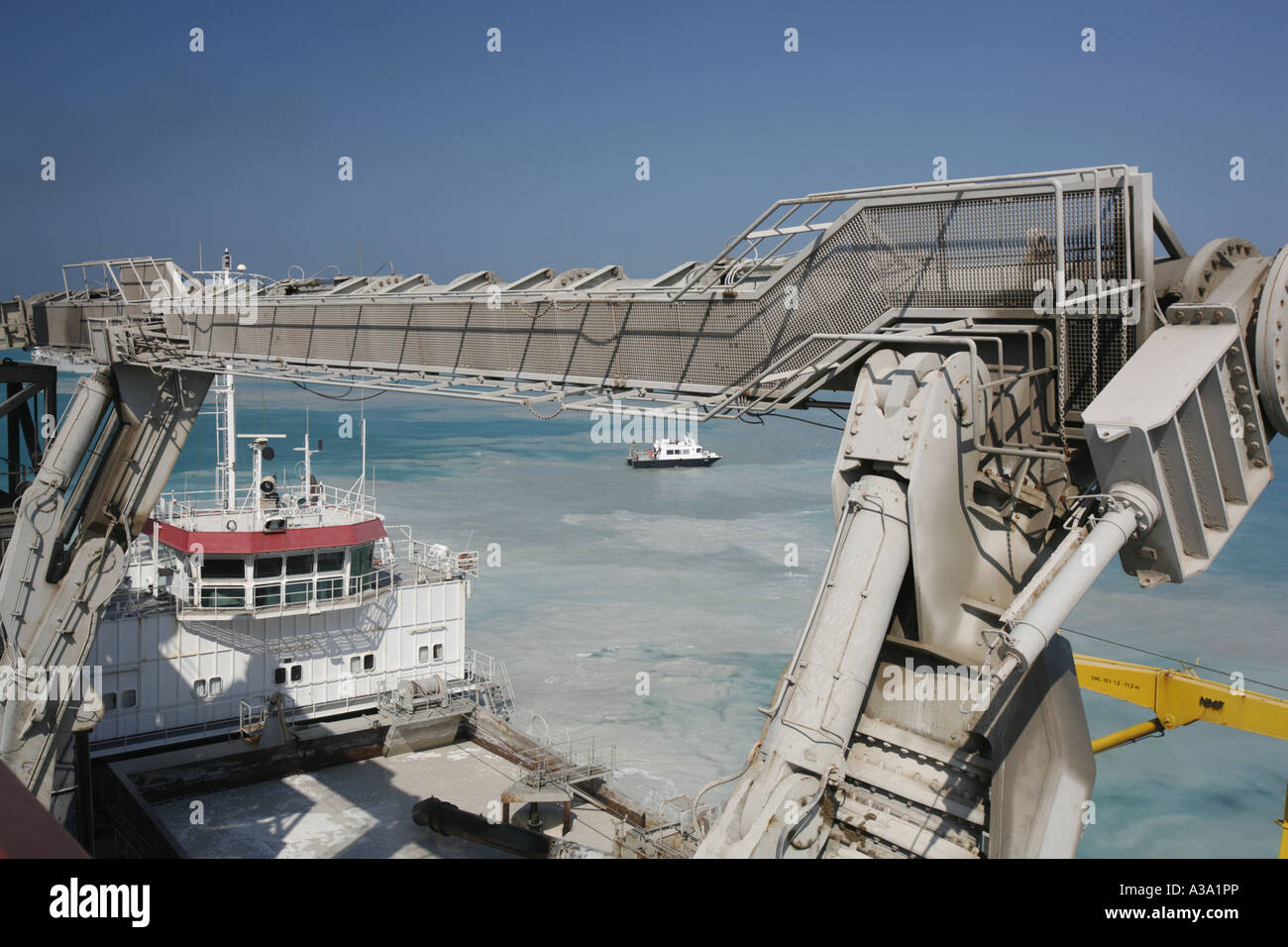 Cutter Suction Dredger at work loading a split barge for Dubai