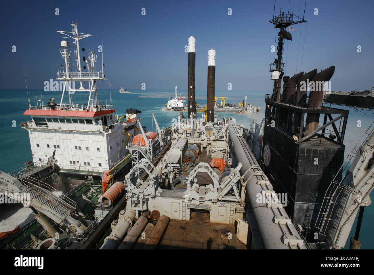 Cutter Suction Dredger at work loading a split barge for Dubai