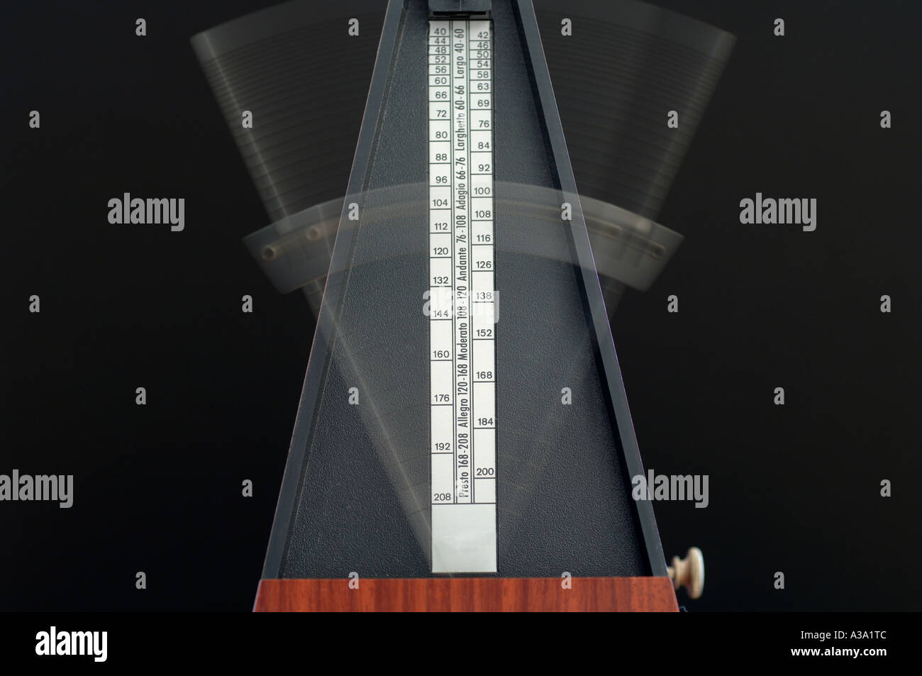 Blurred moving arm on a musicians mechanical metronome. Credit: Malcolm Park/Alamy. Stock Photo