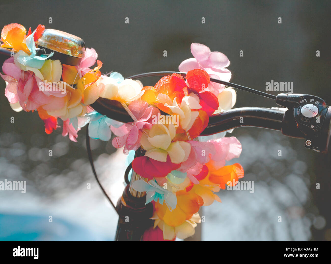 Bike, personalised with coloured flowers and ribbons Amsterdam. Stock Photo
