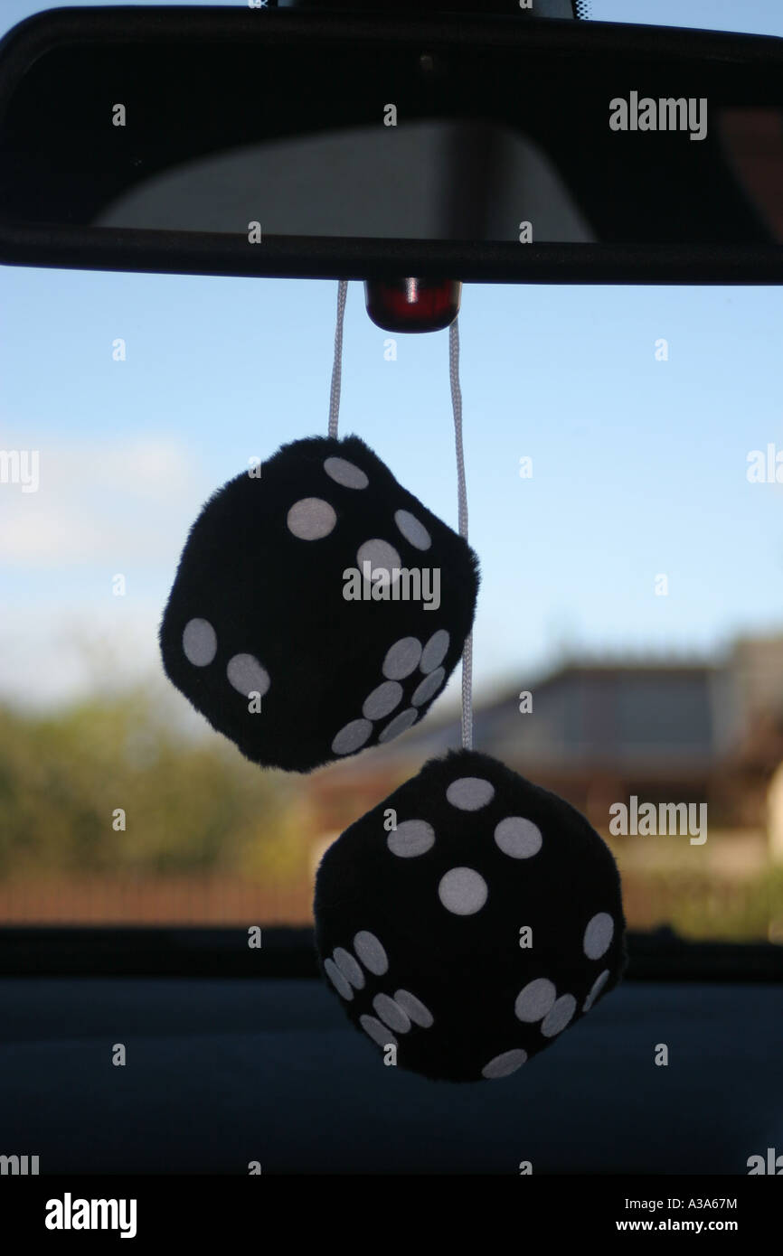 Furry Dice hanging from rear view mirror Stock Photo Alamy