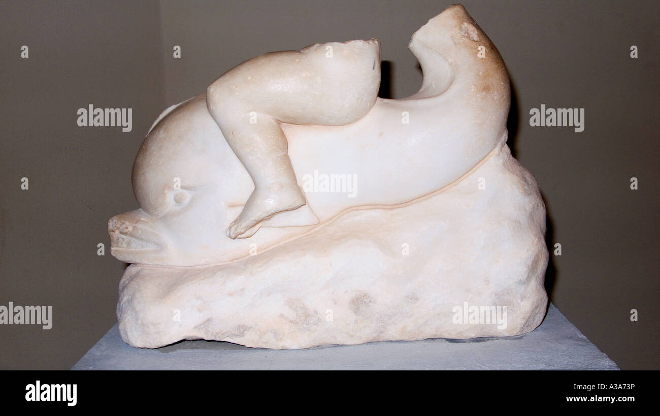 Marble sculpture of cupid on top of a dolphin in Leptis Magna Museum Libya Stock Photo