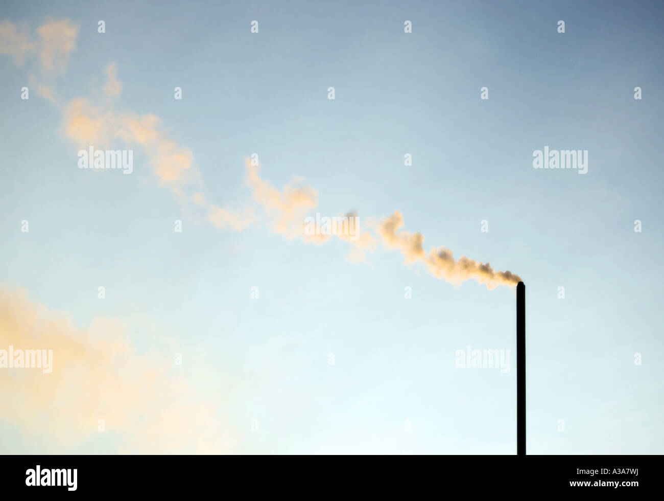 Smoke stack against evening sky Stock Photo - Alamy