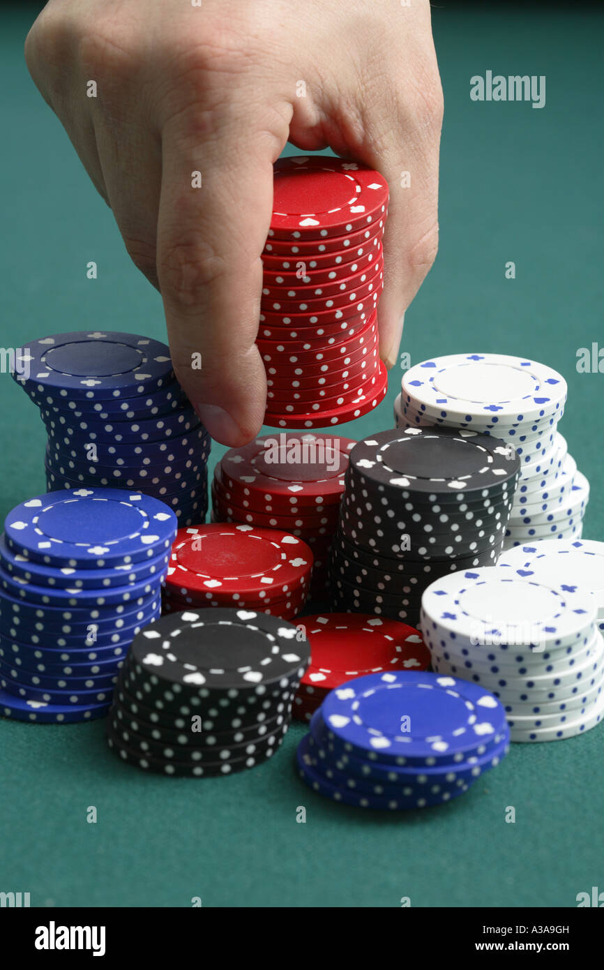 Placing a bet at a poker table Stock Photo Alamy