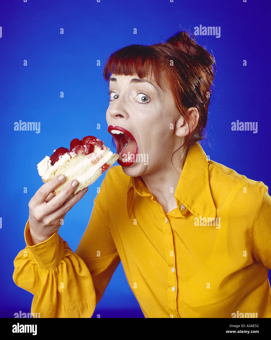 Girl eating cake Stock Photo