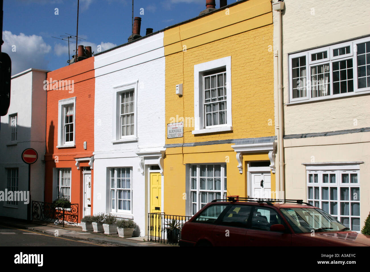 Brightly painted Victorian terrace houses Chelsea London UK Stock Photo