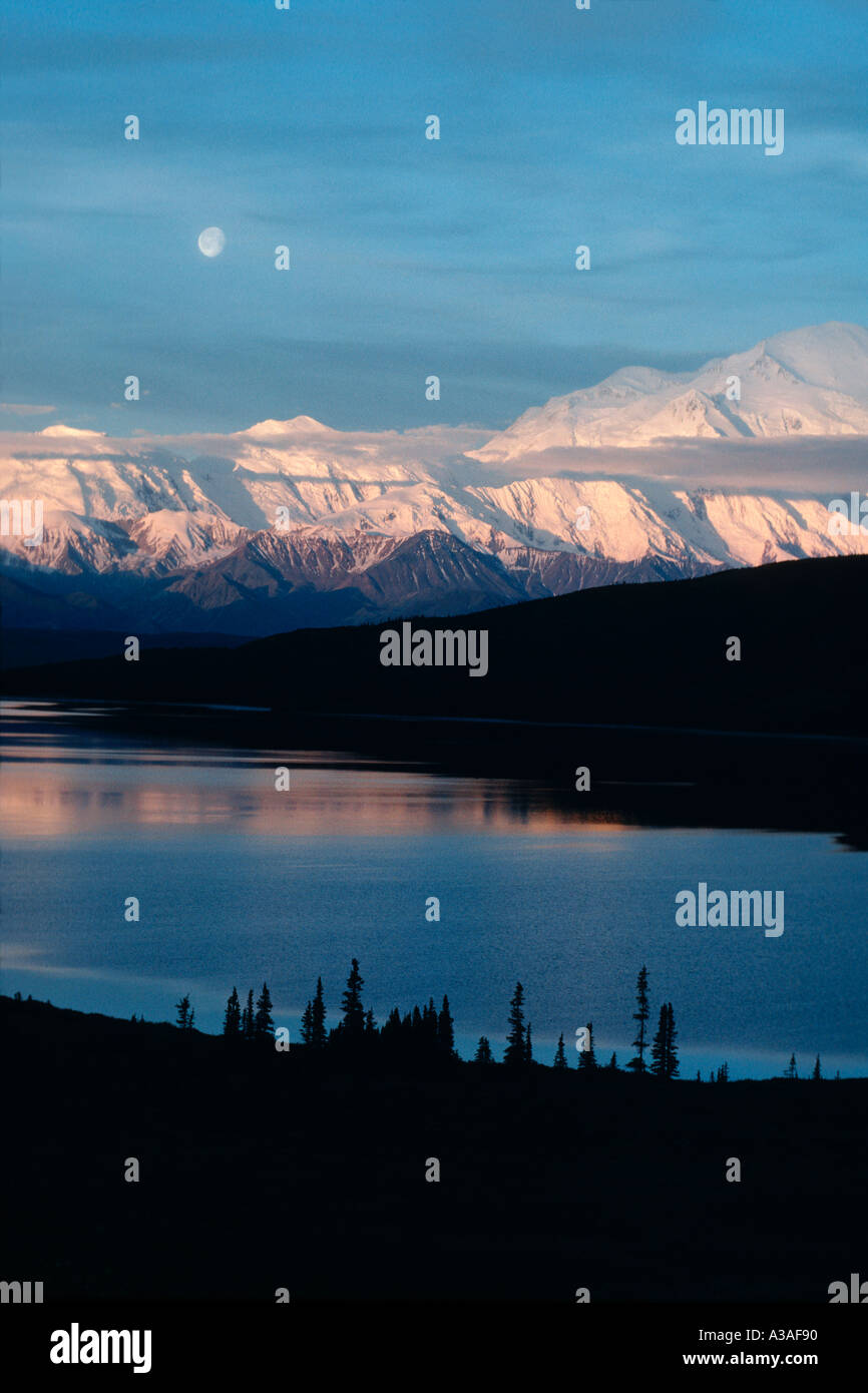 Denali National Park Alaska USA Mt McKinley and the Alaska Range reflection in Wonder Lake Sunrise and Moonset at 3AM Wond Stock Photo