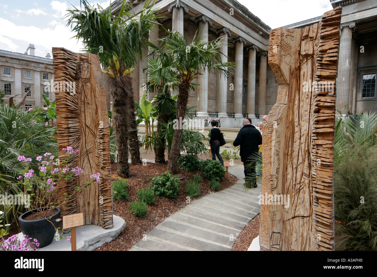 Visitors enter the African art exhibit outside the British Museum ...