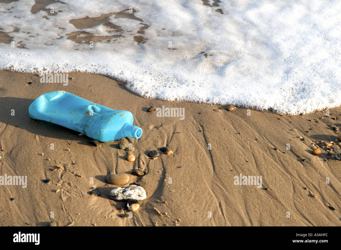 A plastic bottle washed up on the beach Stock Photo