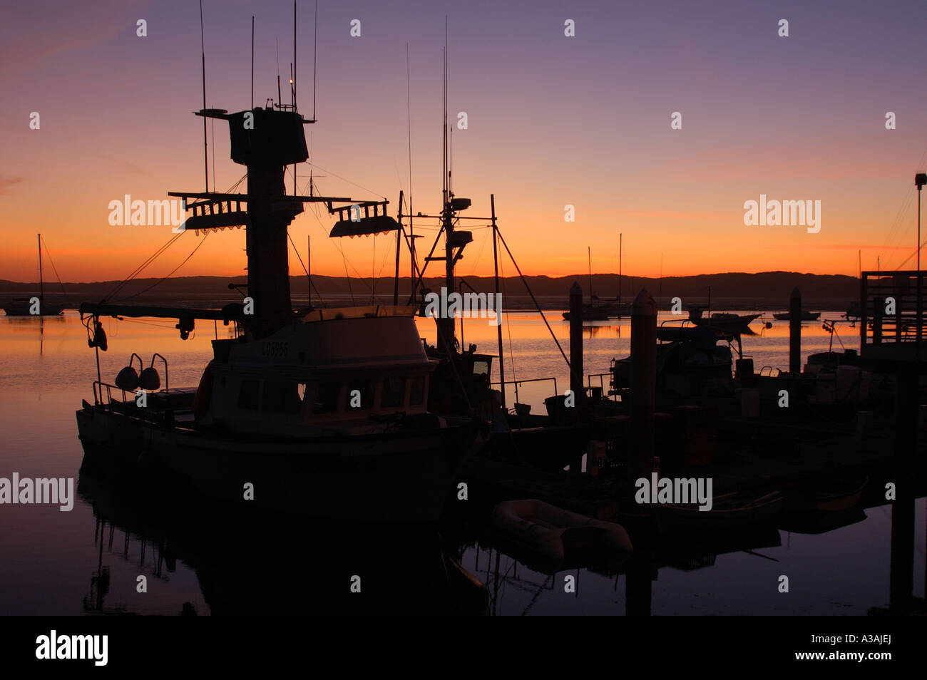 Fishing Boat Silhouette Stock Photo - Alamy
