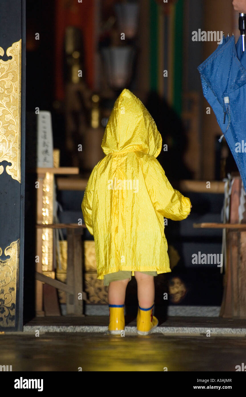 girl in yellow raincoat tokyo Japan Stock Photo Alamy