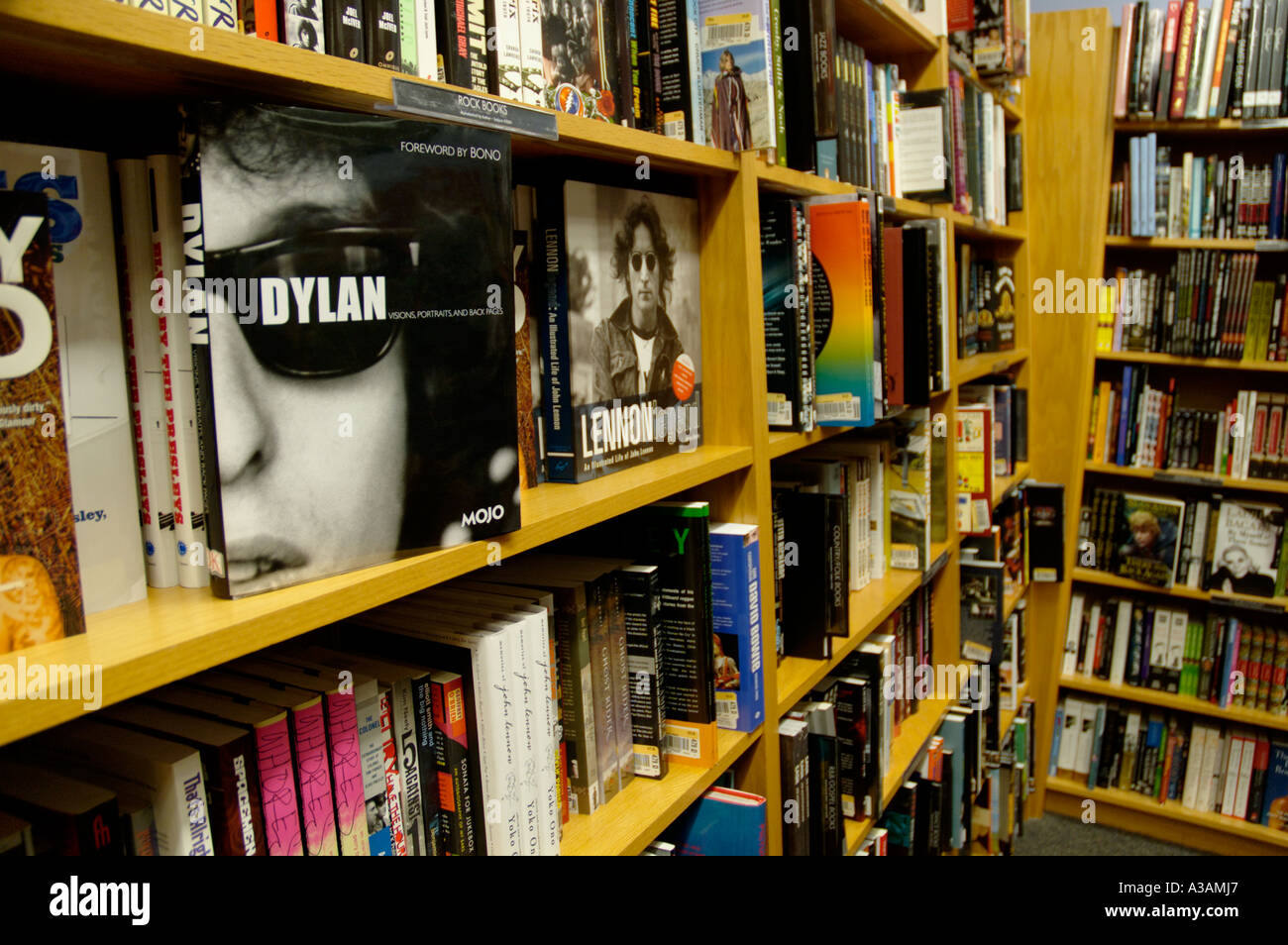 Shelves of books at a retail book store Bob Dylan cover showing Stock Photo