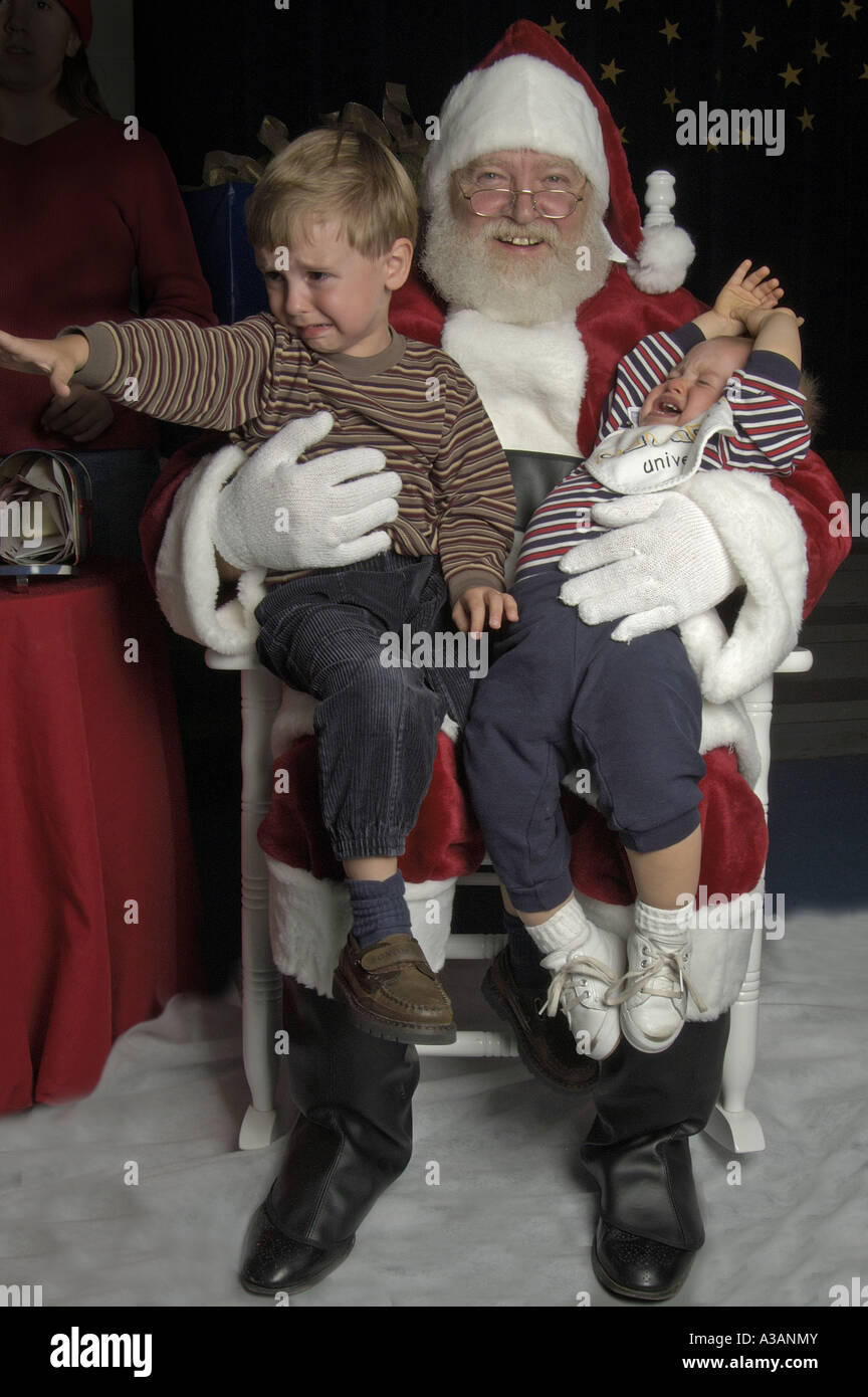 P25 040 Brothers Cry as Santa Smiles Stock Photo