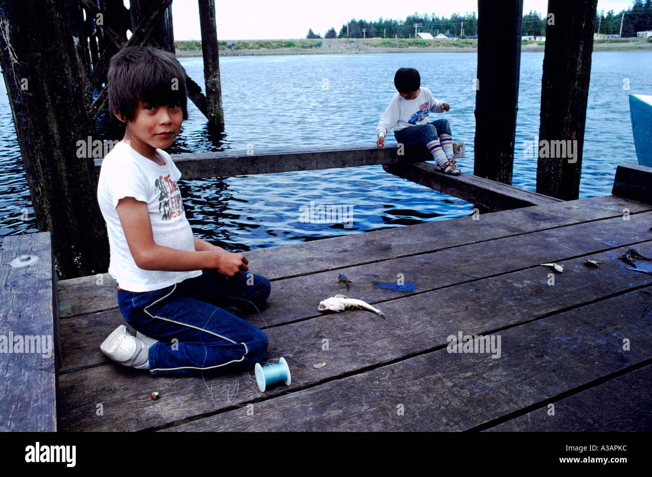 Haida Gwaii (Queen Charlotte Islands), BC, British Columbia, Canada Native Indian Boys fishing