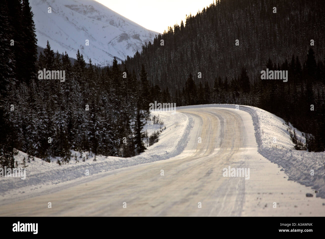 Highway through Rocky Mountains in winter Stock Photo - Alamy