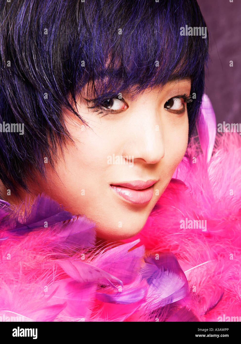 Asian Ethnic Model Girl With Black And Blue Trendy Haircut Looking
