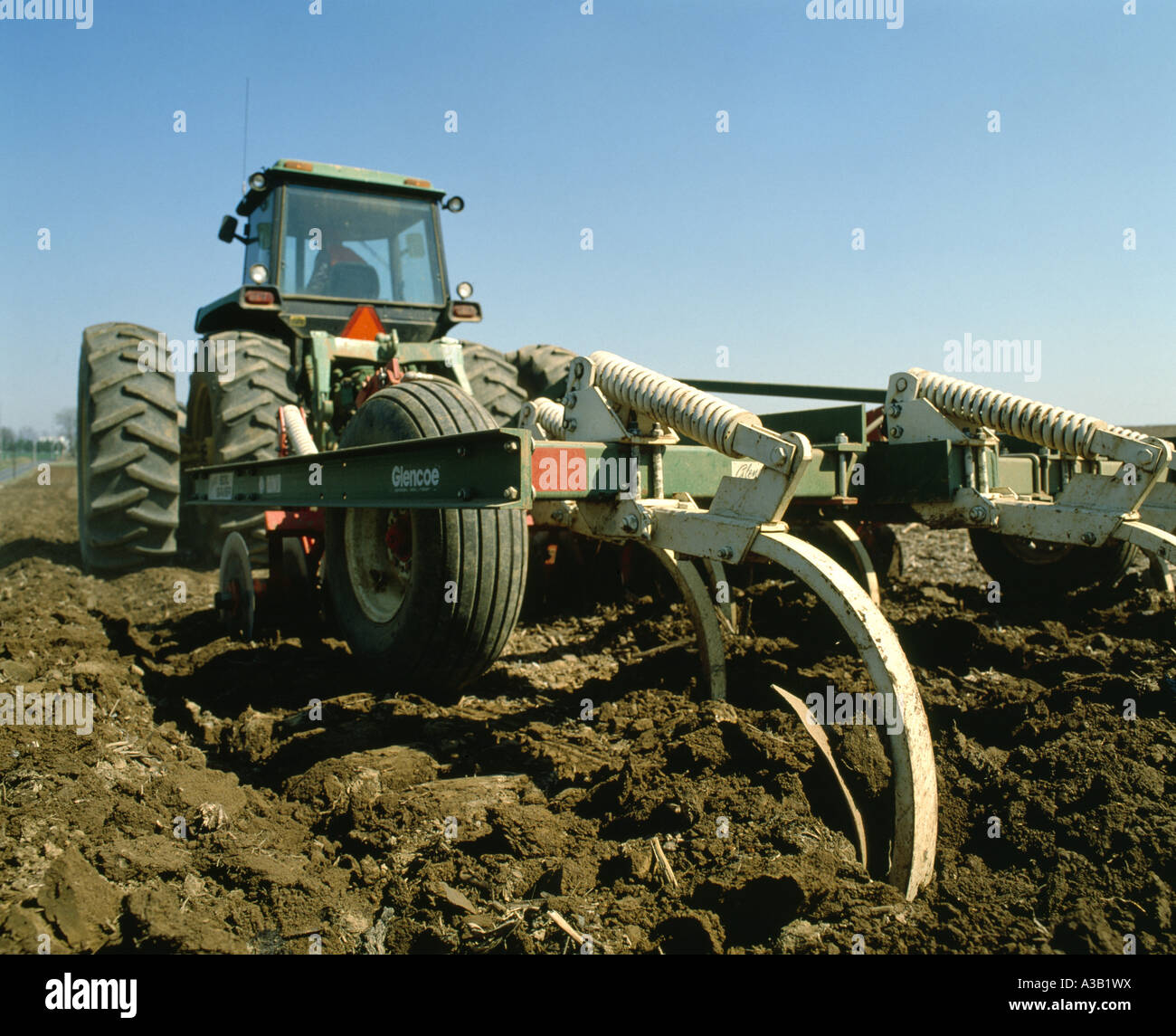 WORKING GROUND FOR CORN USING CHISEL PLOW AND DISK COMBINATION Stock Photo