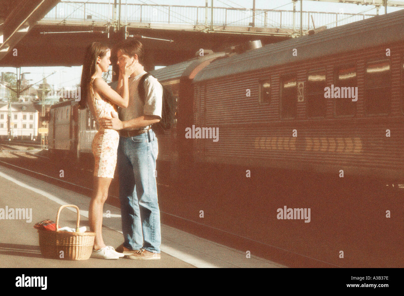 Romantic young couple on train platform in Stockholm, Sweden Stock Photo