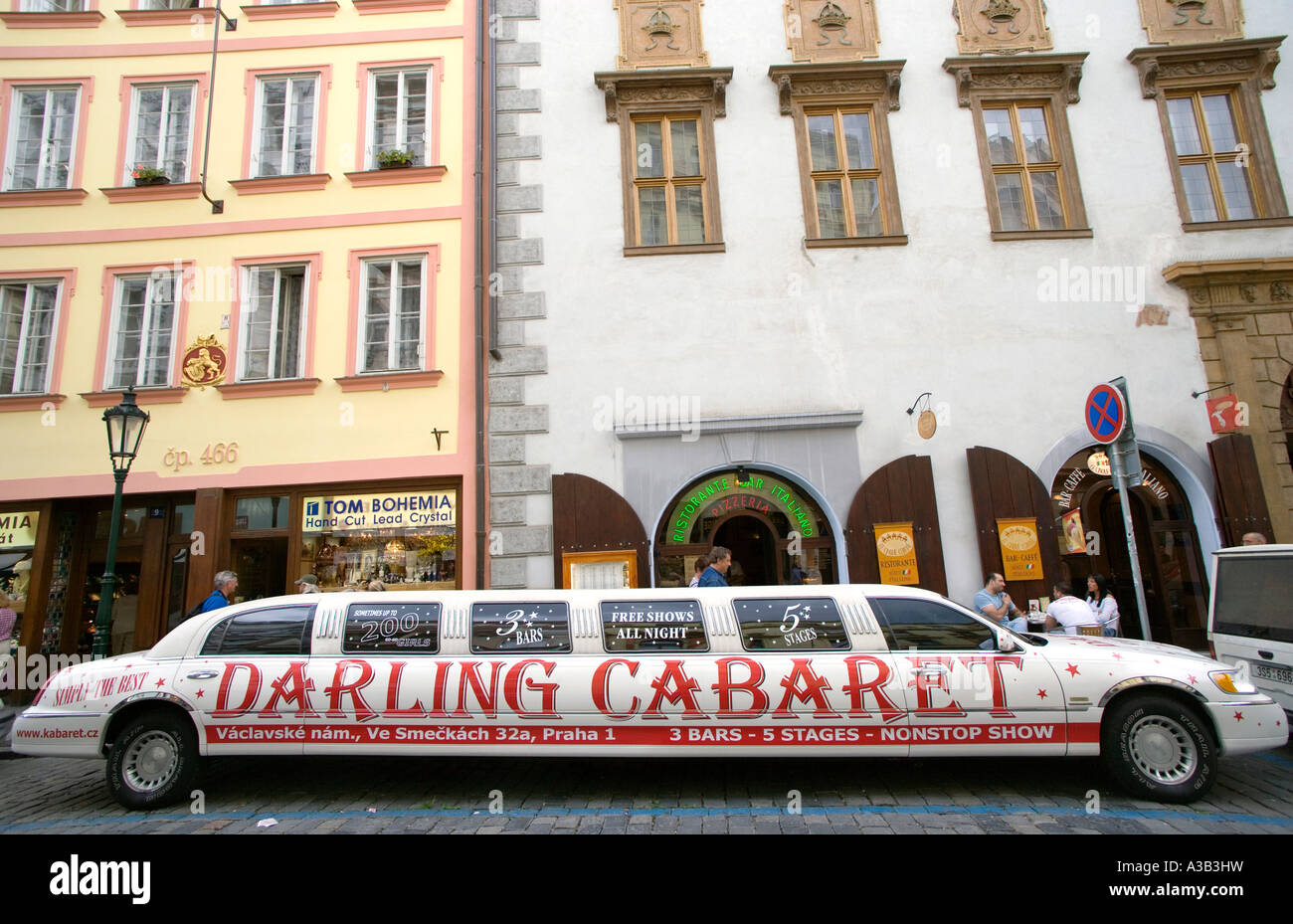 CZECH REPUBLIC Bohemia Prague Old Town Stretch or stretched limousine advertising Darling Cabaret nightclub parked by pavement. Stock Photo