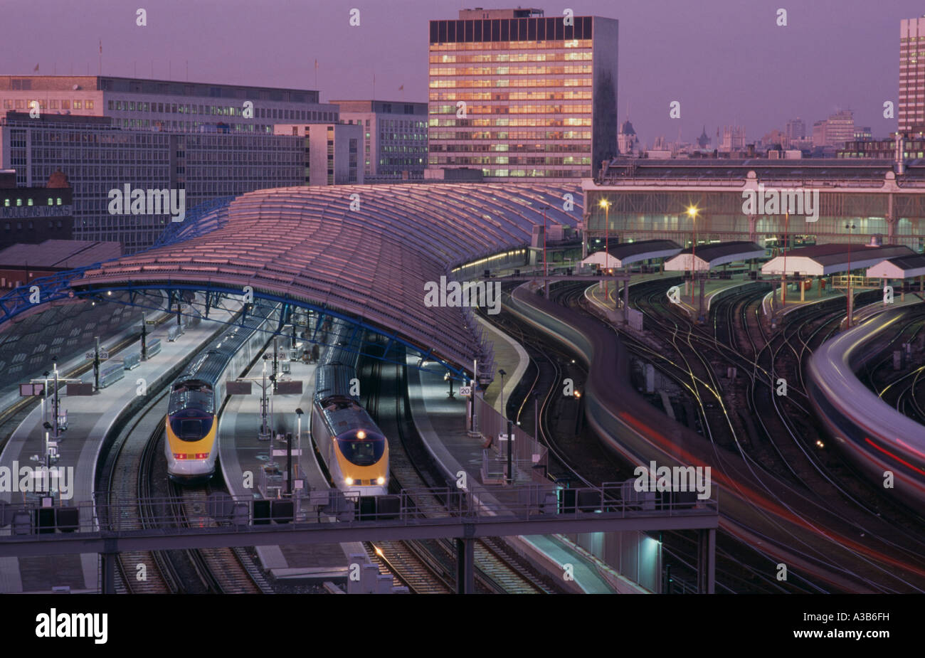 ENGLAND London Waterloo Station International Terminal with Eurostar cross channel trains at platforms with buildings beyond Stock Photo