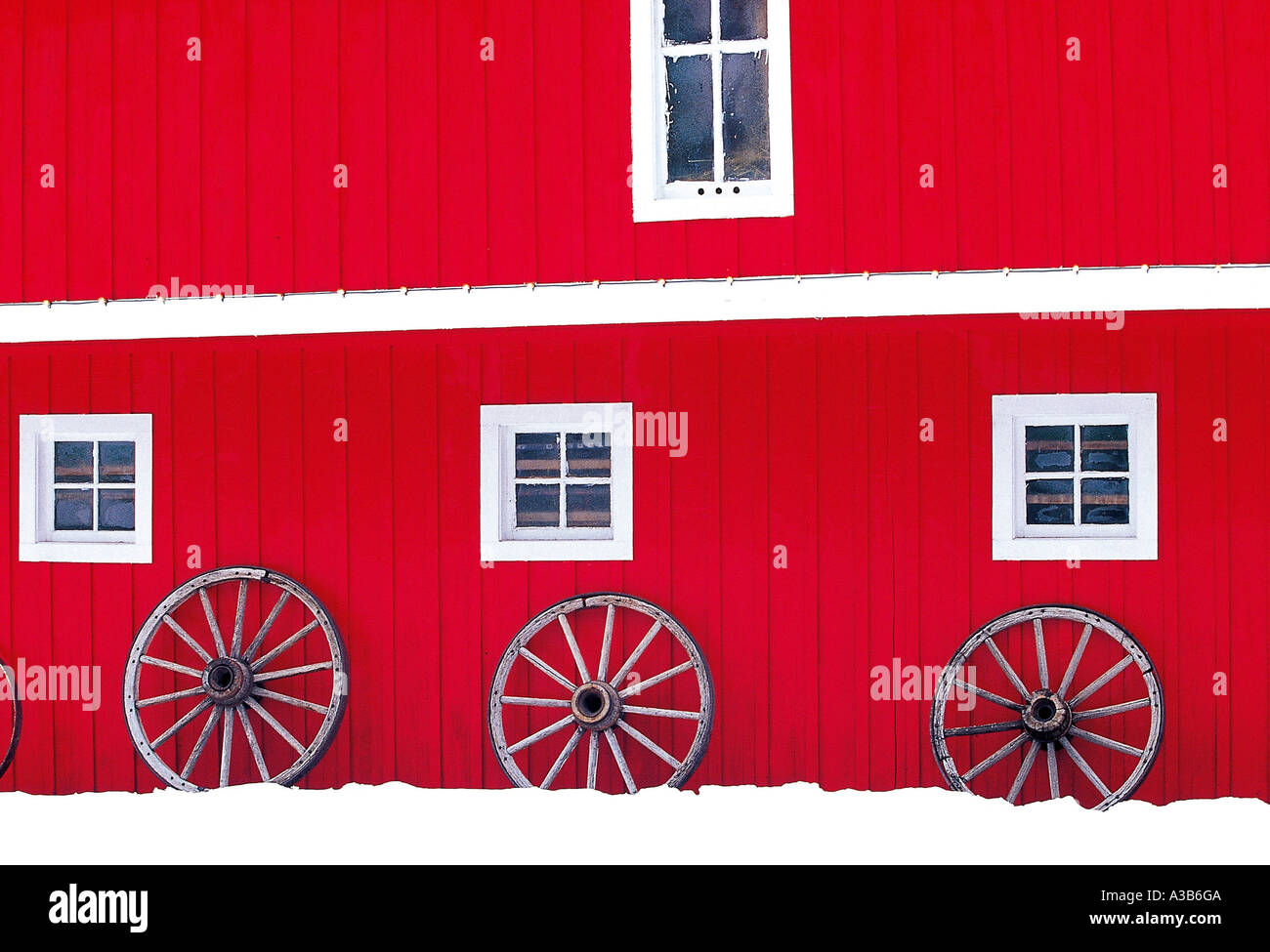 A red colored warehouse with four windows Stock Photo - Alamy