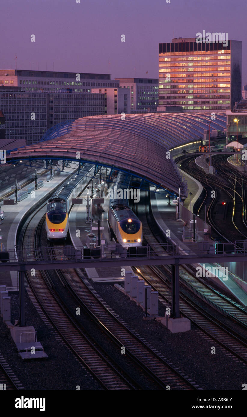 ENGLAND London Waterloo Station International Terminal with Eurostar cross channel trains in evening with City buildings behind Stock Photo