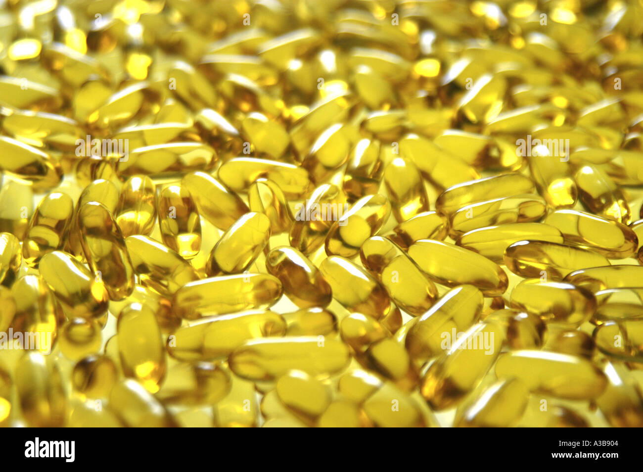 Evening Primrose Oil capsules, shot with shallow depth of field to make distant ones out of focus. Stock Photo