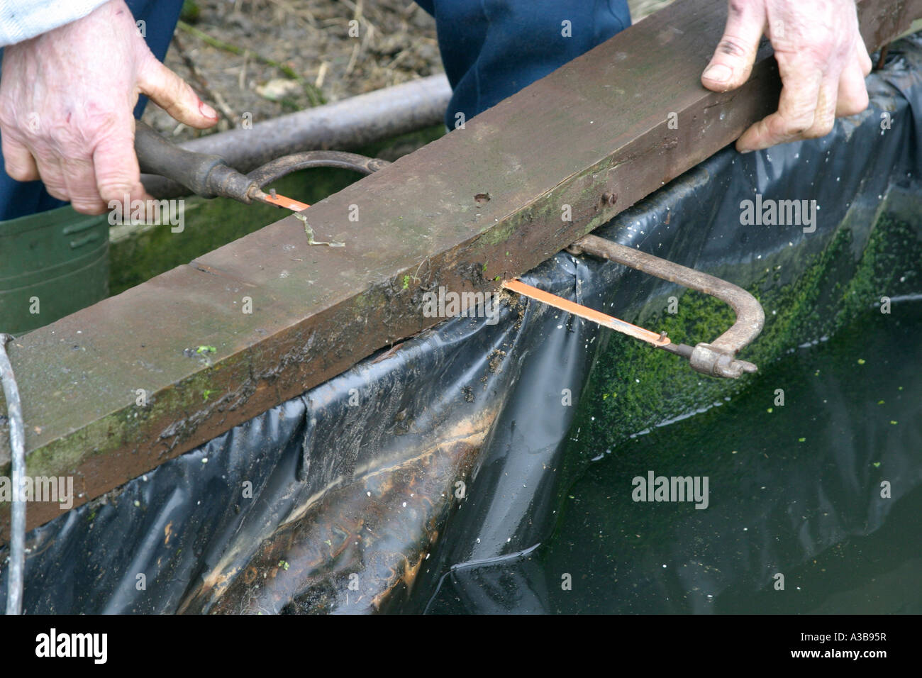 changing the liner remove the pond edging Stock Photo