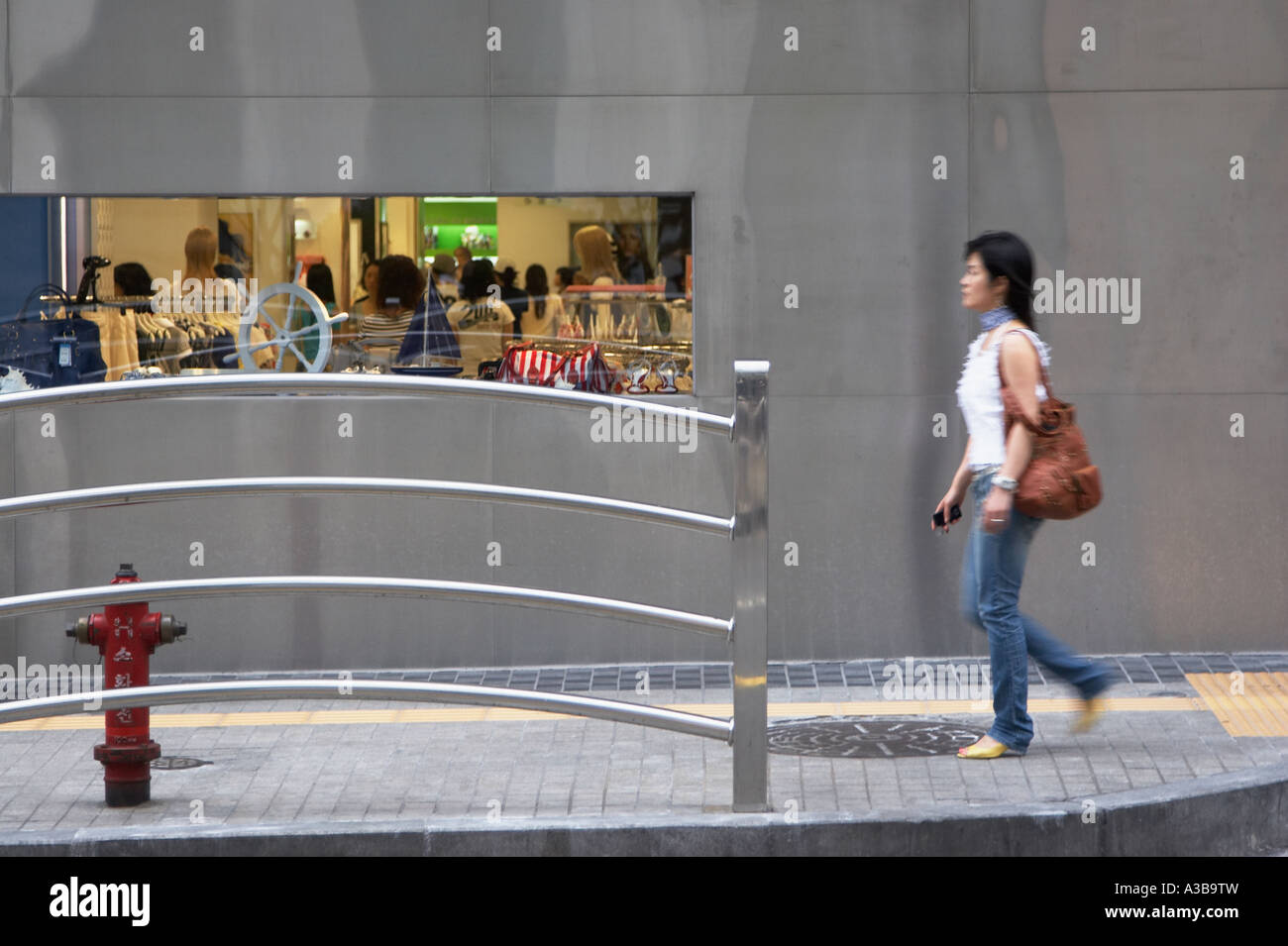 Asian woman power walking hi-res stock photography and images - Alamy