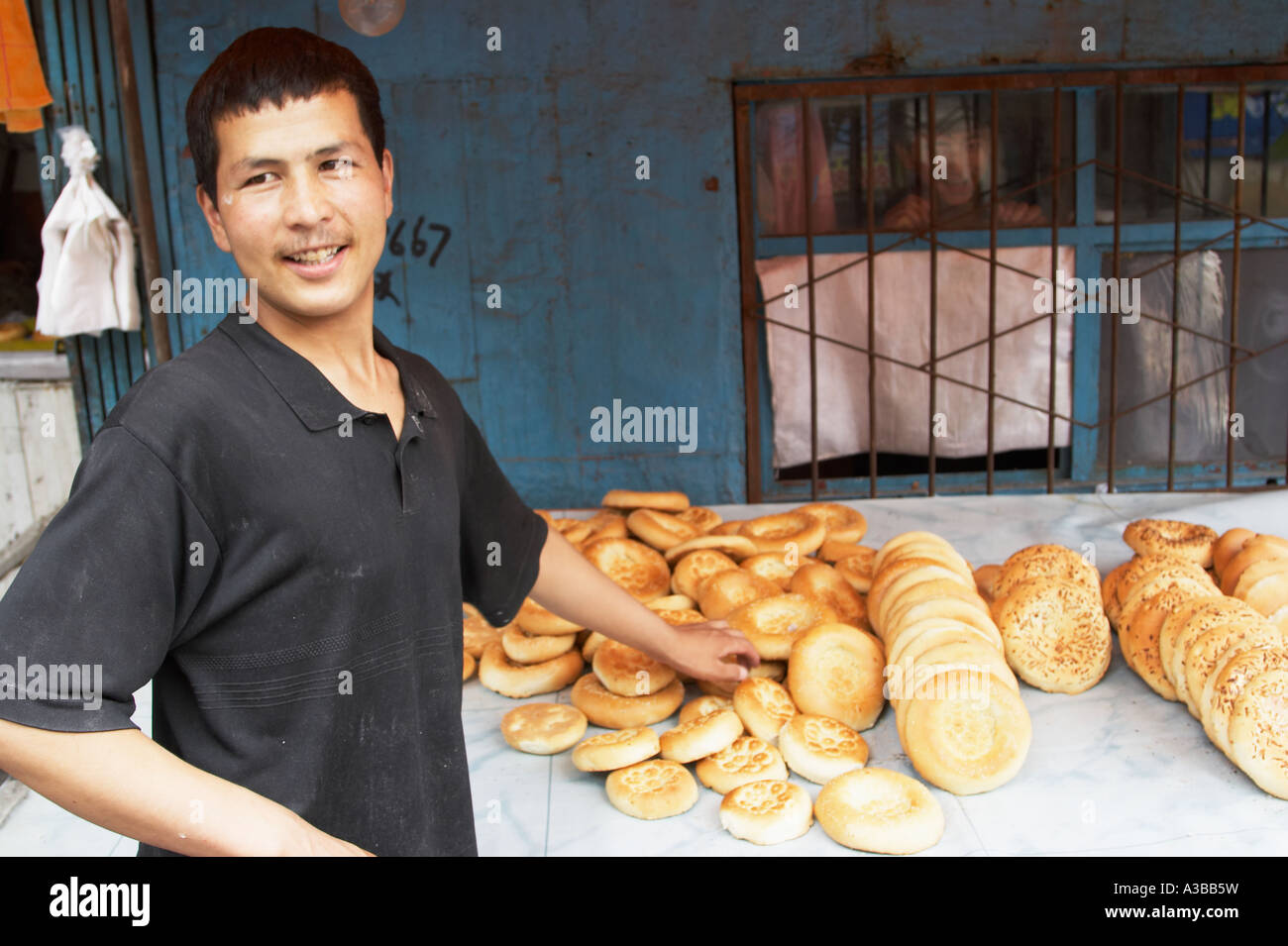 Baker Selling Bread Stock Photo Alamy