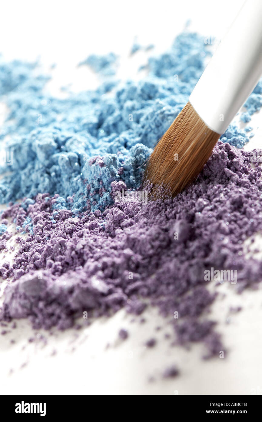 Putting cosmetic stuff on the brush Stock Photo