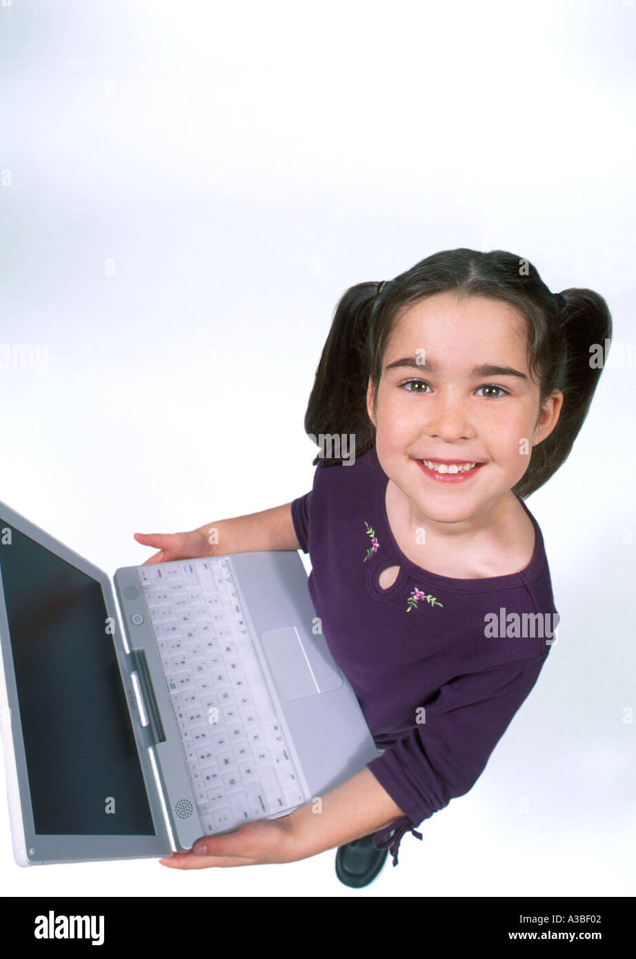 Hispanic young girl from above with computer Stock Photo - Alamy