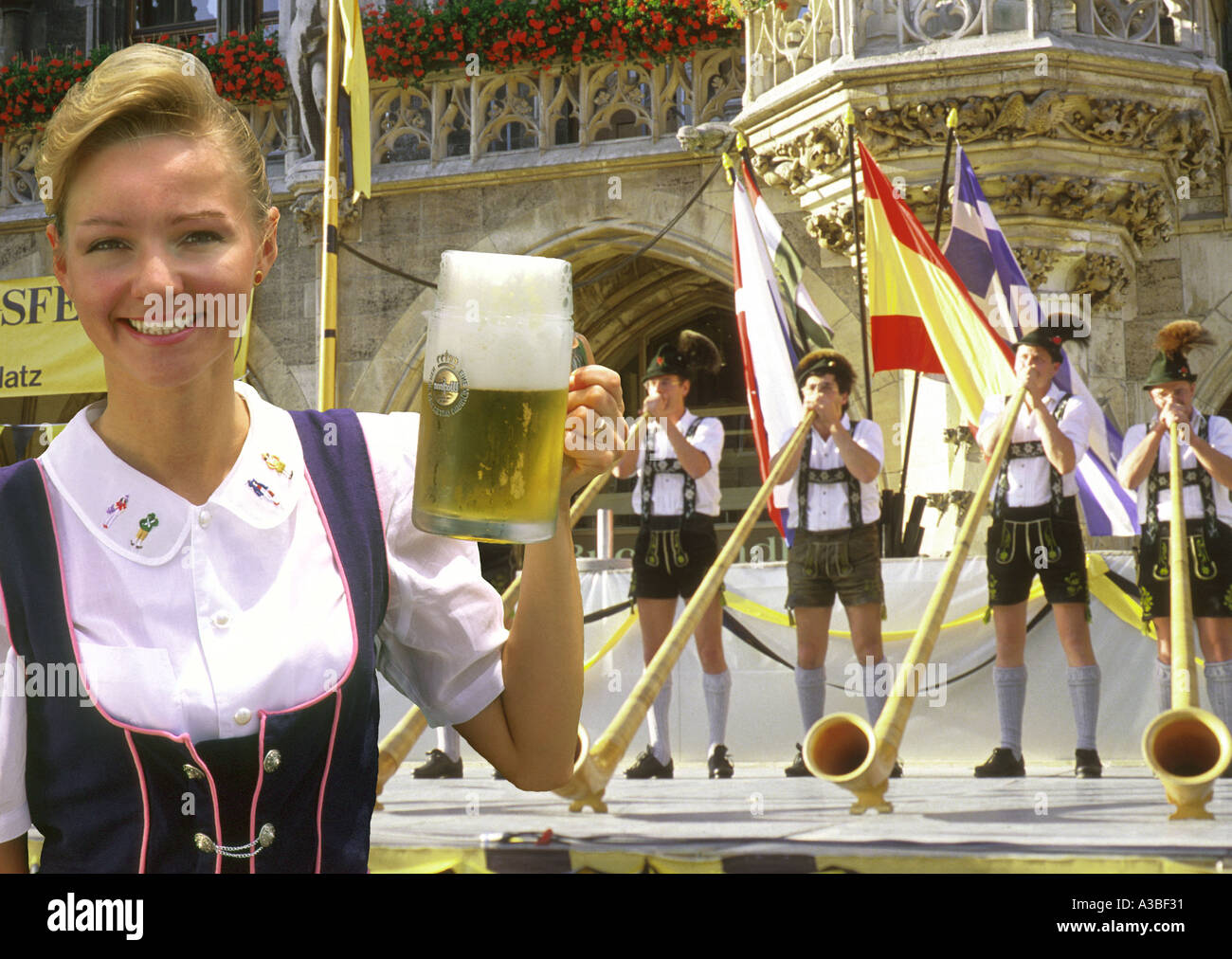 German woman holding stein of beer at Oktoberfest in Munich, Bavaria Stock Photo