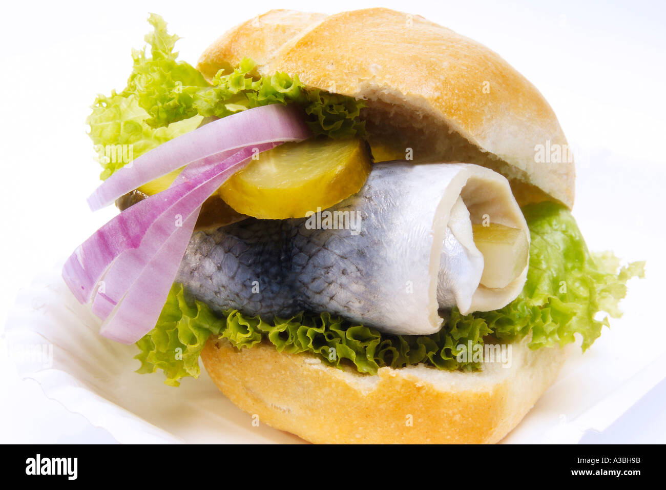 Bread roll with rollmops and onion Stock Photo
