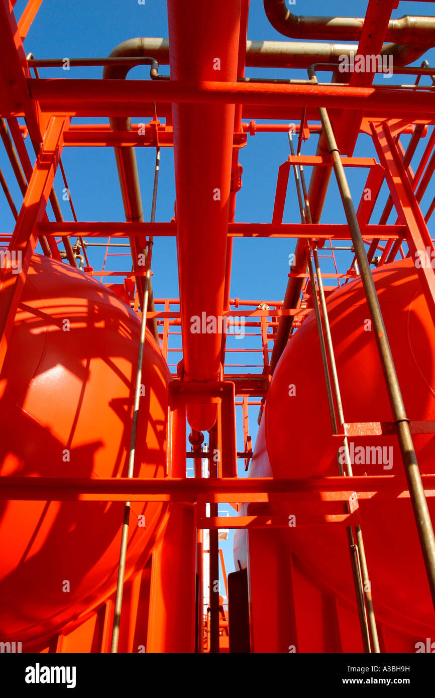 Bright red gas tank and pipes Stock Photo Alamy