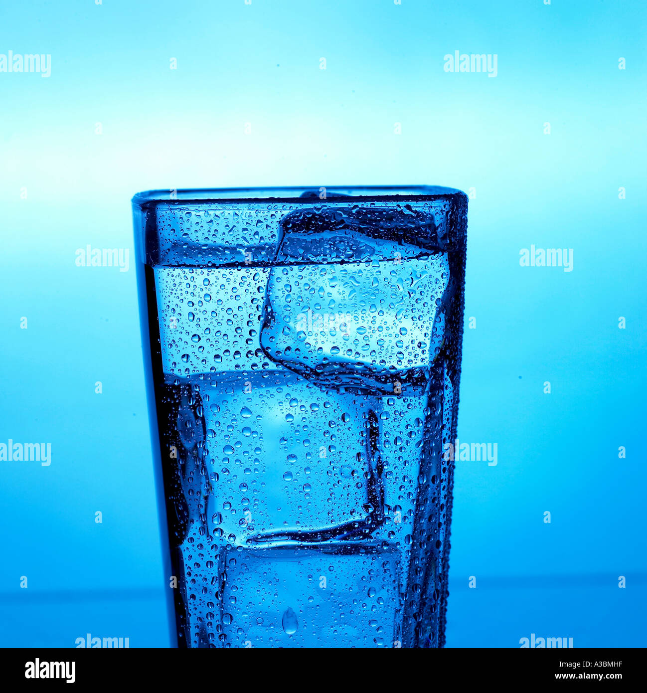 a glass of water with ice cubes Stock Photo - Alamy