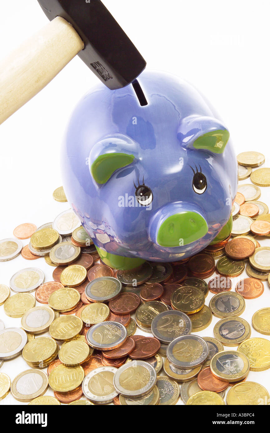 Hammer over piggy bank Stock Photo - Alamy