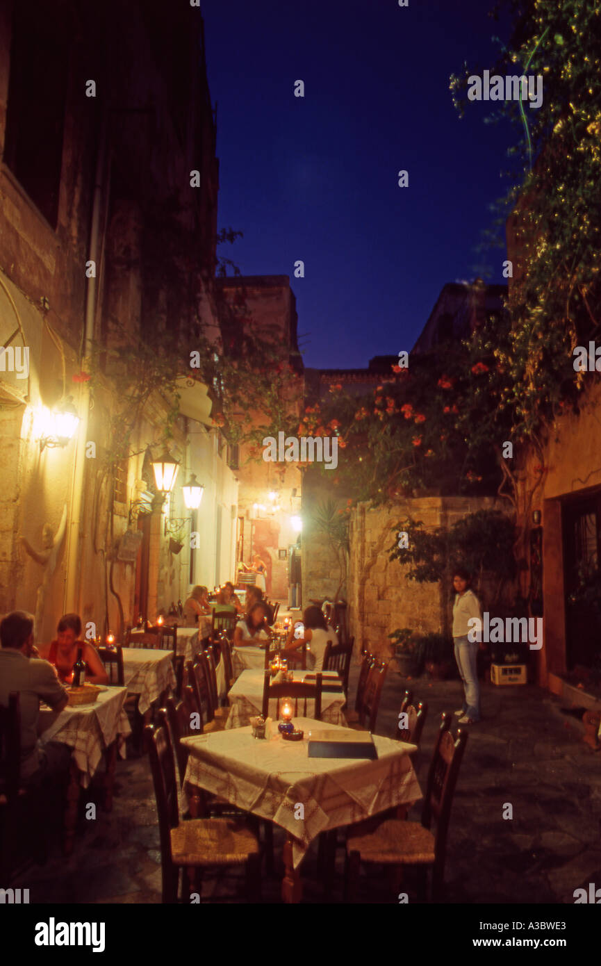 Typical Venetian Alleyway And Restaurants At Night In Chania Old Town typical-venetian-alleyway-and-restaurants-at-night-in-chania-old-town