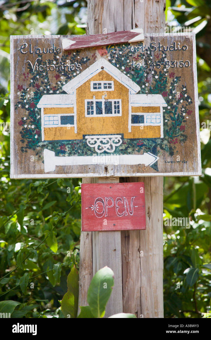WEST INDIES Caribbean St Vincent The Grenadines Bequia Island Lower Bay Beach Sign for Claude Victorine's art studio gallery Stock Photo