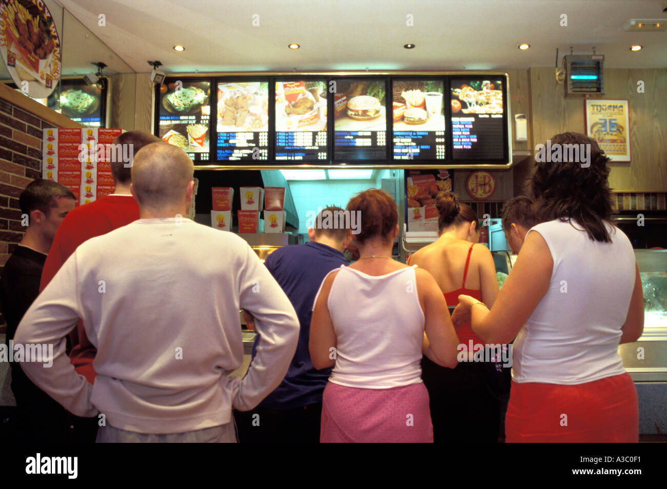 British holidaymakers buying fast food at take away on night out in Ibiza Stock Photo
