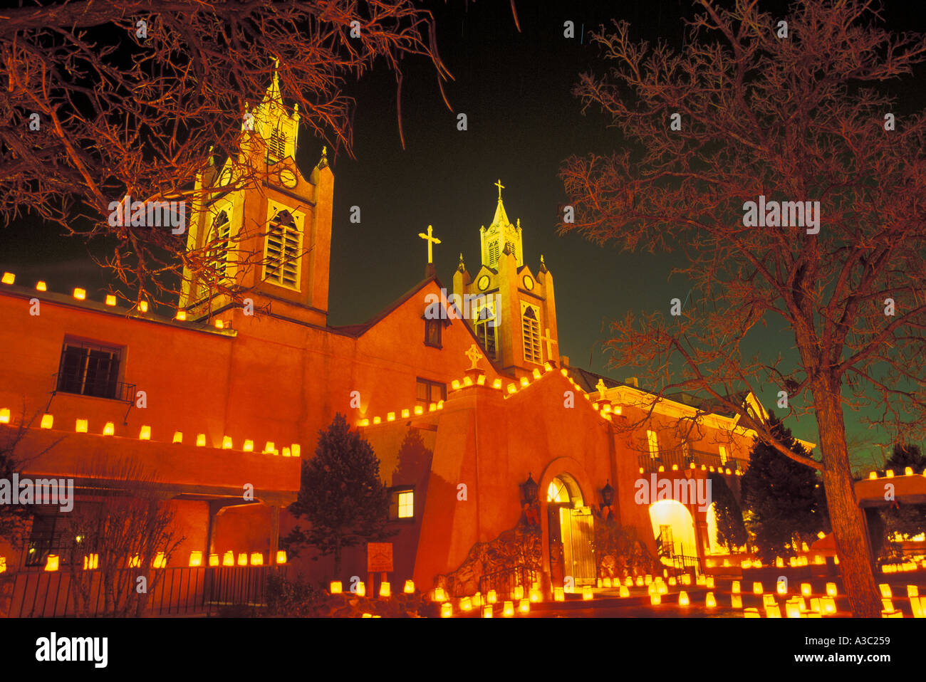 Evening shot of San Felipe de Neri Church with luminarias on Christmas