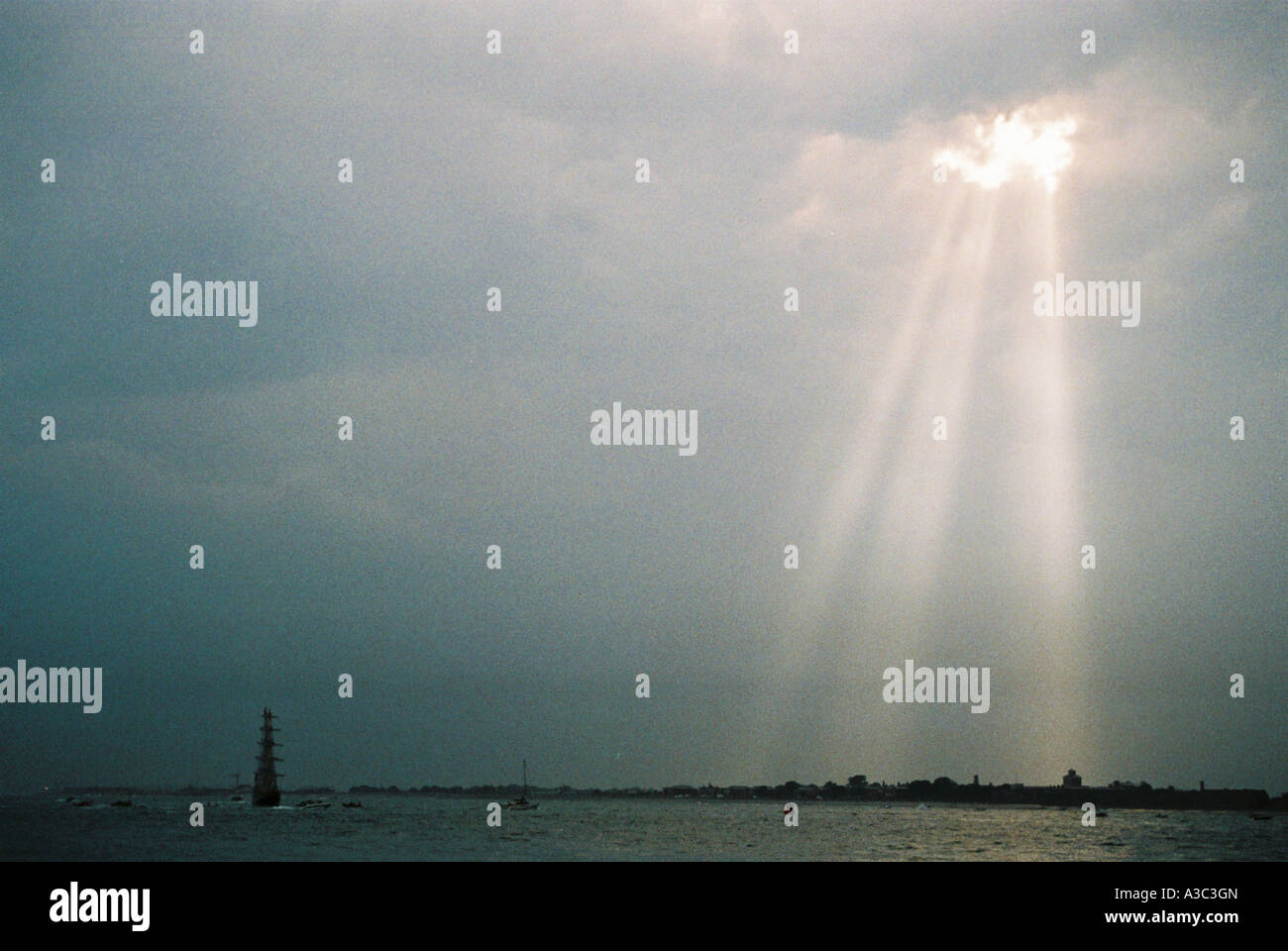 sun rays breaking through clouds Stock Photo - Alamy