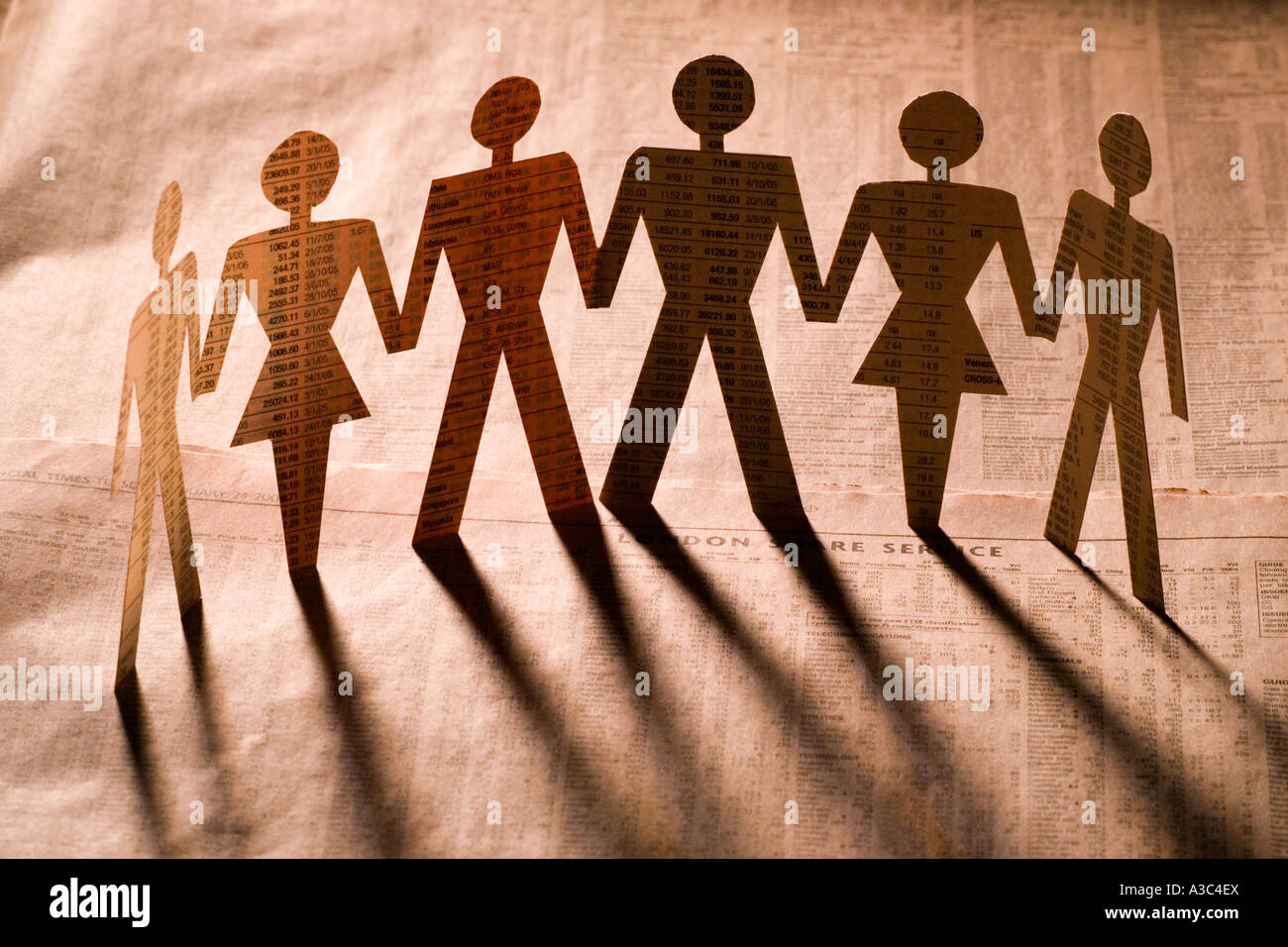 Financial Times Paper men and women cut outs in pink orange Stock Photo -  Alamy