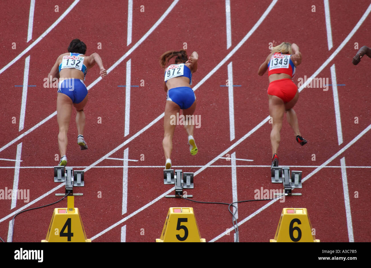 runners at the start of a 100m hurdles race at the Munich European ...