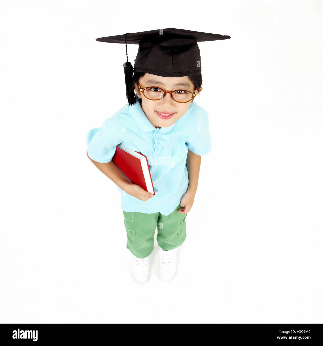 Boy student wearing graduation cap hi-res stock photography and images ...